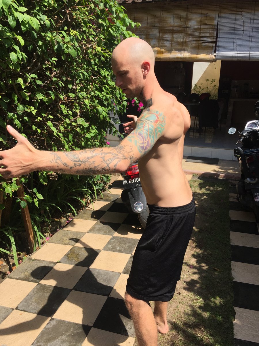 Justin photographed from behind before, thin through the back and shoulders.